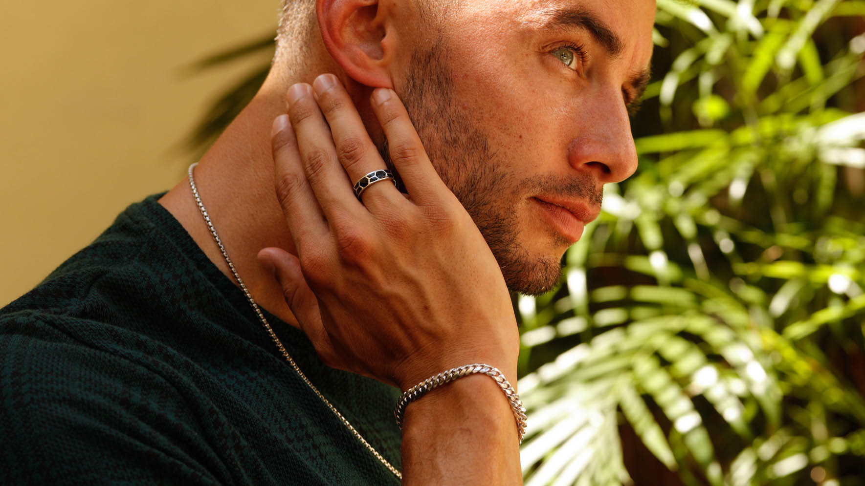 Image of men with ring, necklace, and bracelet